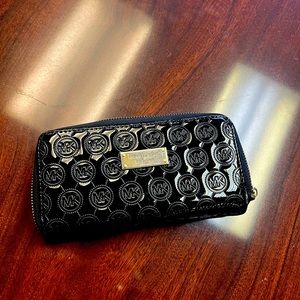 Michael Kors black patent wallet.